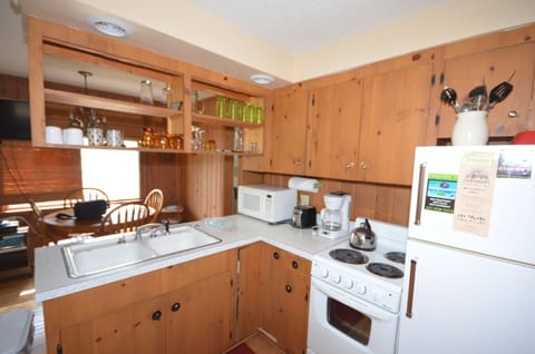 Kitchen area - Fully equipped, cooking basics, dishware & flatware, microwave, toaster, drip coffee maker, trash bags, paper towels.
