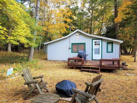 Outdoors - Fire pit, gas grill, deck, outdoor chairs, private river frontage.