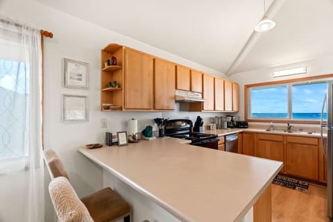 Upstairs full kitchen with ocean views