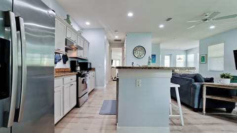 Large kitchen bar for food prep and gathering