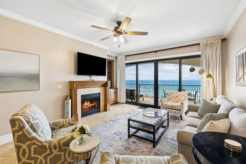 Unwind in your serene living space with sweeping ocean views and a cozy fireplace. Perfect for relaxing evenings after sun-soaked beach days.
