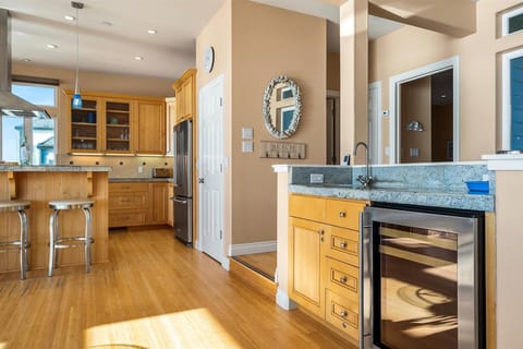 And a wet bar with sink & a beverage/wine fridge