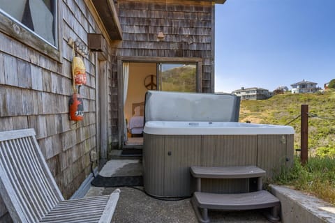The hot tub is steps away from Bedroom 2.