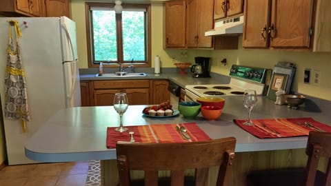 Full kitchen with coffee maker.