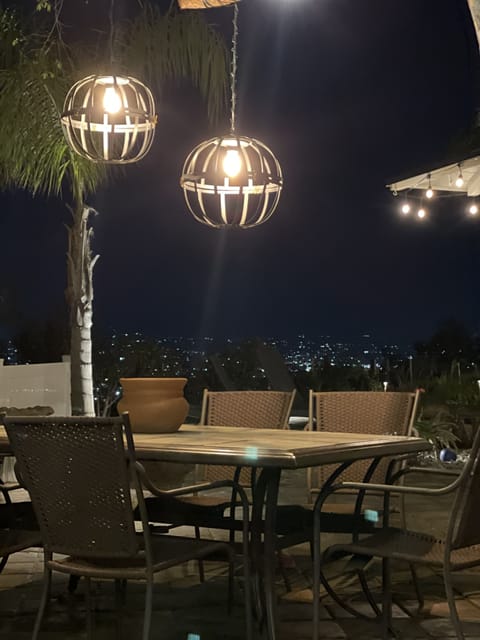 Outdoor dining overlooking the city lights