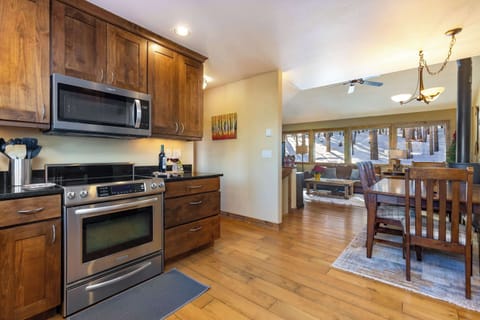 A fully stocked kitchen with ample counter space, offering stunning east-facing views of sunrises, Keystone Resort, and the iconic Grays & Torreys Peaks (14ers) on the Continental Divide.
