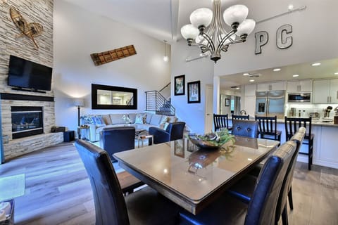 Open concept main level with huge ski run views with fireplace, HDTV & seating