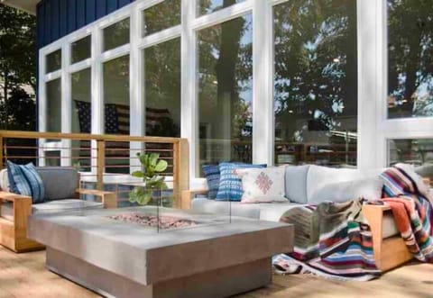 [Lakefront Home | Back Patio] Gather Around the Modern Fire Pit Behind the Lakefront Home and Make Memories That Last a Lifetime.