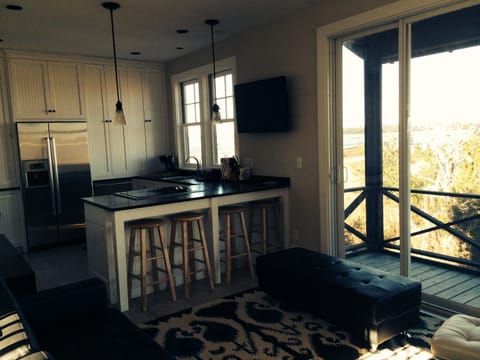 Den/ Kitchen  with 42' TV.  The glass doors open completely.