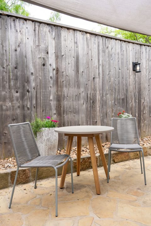 Outdoor Bistro Dining – Courtyard table for morning coffee.