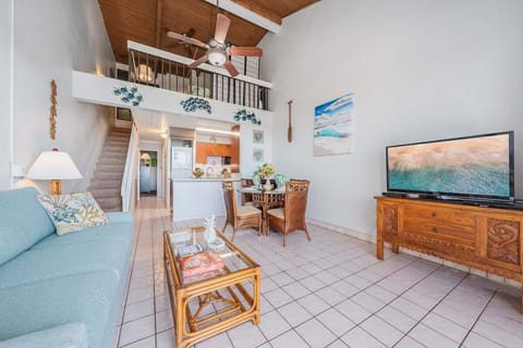 Enjoy a homey atmosphere with a large TV, comfortable seating, and a dining area perfect for family meals