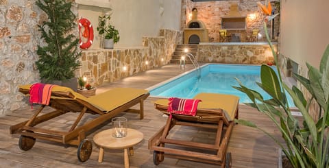 The swimming pool is constructed in a very beautiful landscaped and private space