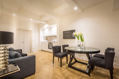 The living room with a sofa bed and the modern kitchenette