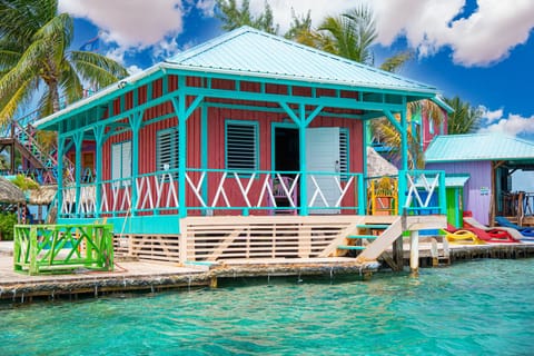 Colorful overwater cabana with stunning Caribbean Sea views in Belize.