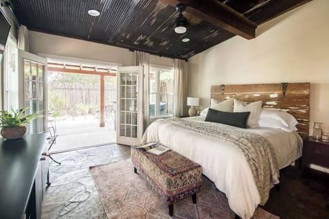 King bedroom with French doors opening to private courtyard