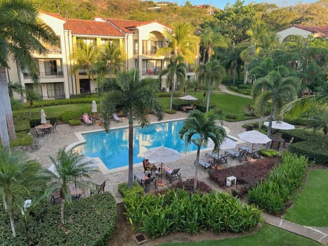  Activity pool as viewed from condo balcony. Lounges, tables+umbrellas provided