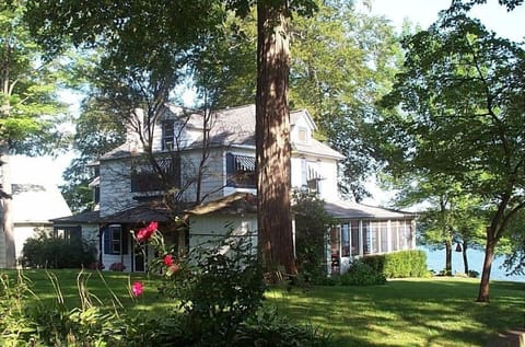 Gorgeous home on 155 feet of sandy beach frontage with large deck and dock