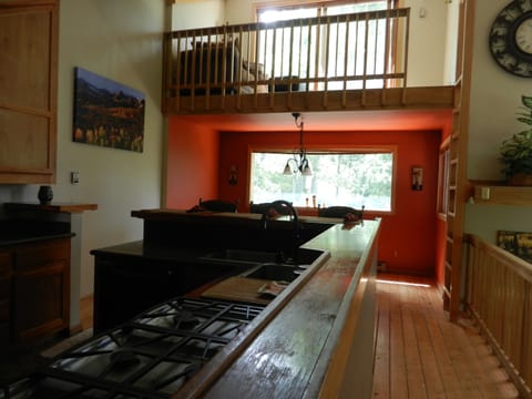 Kitchen, dining room and upper loft.