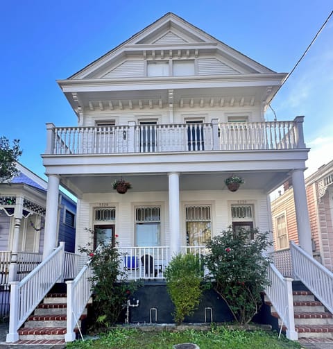Front of house. Main entrance on right.