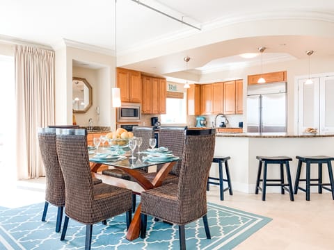 Gourmet kitchen with commercial fridge, ice maker, wet bar, and wine fridge. 