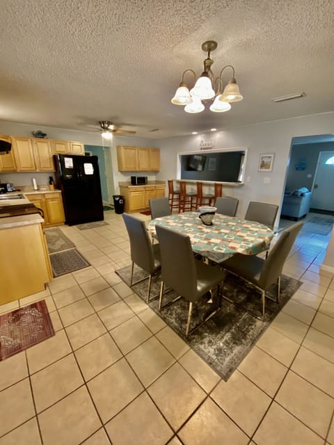 Full kitchen has pots, pans and necessities if you want to cook or stay in