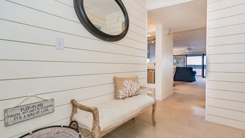 Entryway with shiplap and nautical décor greet you. 
