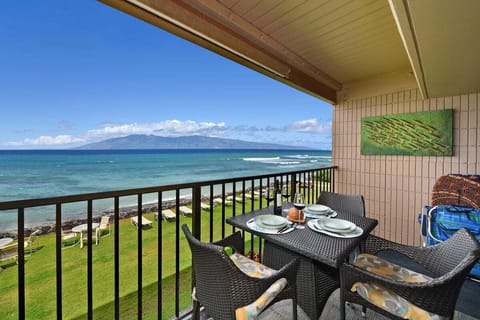 Private balcony with island views and table set for al fresco dining
