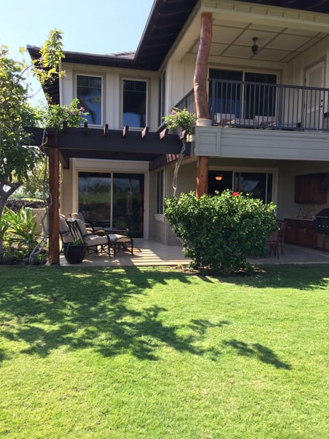Private two story villa with nice lawn out back, adjacent to the golf course