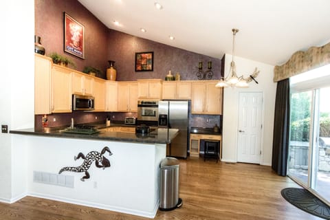 Kitchen has Keurig, pantry and double ovens.