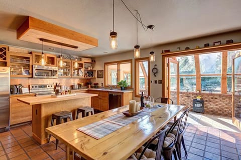 Huge country kitchen opens up to the sunroom. Farmers table to dine with your loved ones