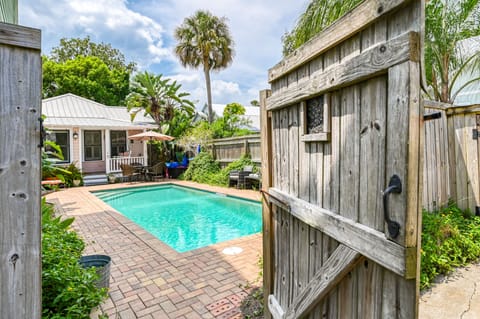 The circa 1875 Cottage overlooks the private heated pool. 
