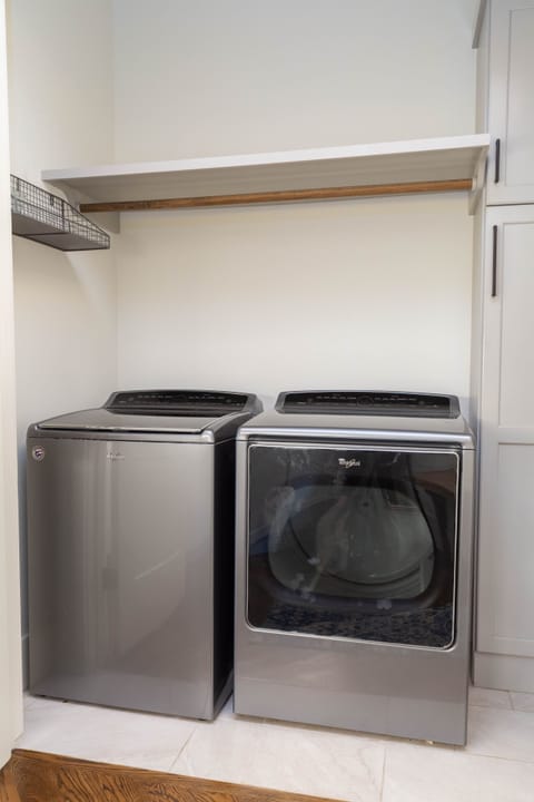 Laundry on main floor, broom close with iron at the right