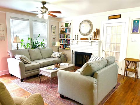 Open concept living space with fireplace and lift chair.  