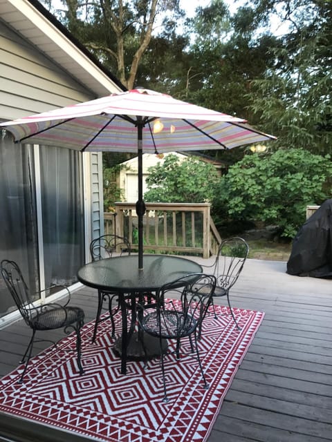 Cozy outdoor patio with gas & charcoal grills for relaxing and entertaining