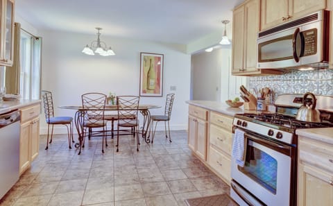 a view of the kitchen with stove, big counters