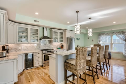 Custom kitchen with high end appliances, unique granite, and huge island!