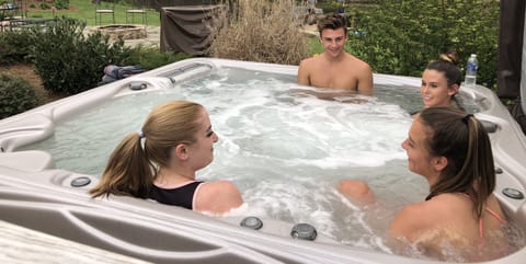 HOT TUB - Clean water ! Near house, fire pit, and pool .