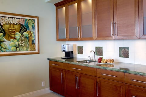 Coffee maker, mini fridge, sink, microwave and music center of the master suite 