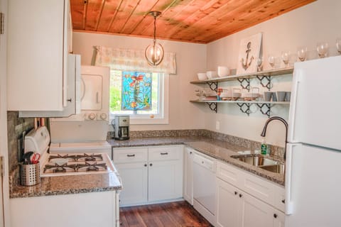 updated kitchen with granite top and gas stove/oven
