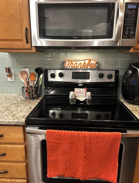 Full size oven with microwave and cooking utensils