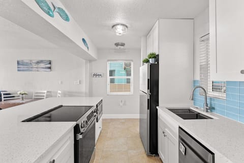 Fully equipped kitchen with a Nespresso, Keurig, drawer microwave, & dishwasher