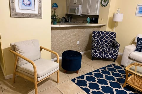 Kitchen breakfast bar pass through allows views of the gulf