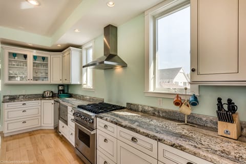 Cooking for a large group is easy in this home +chef can be part of the action