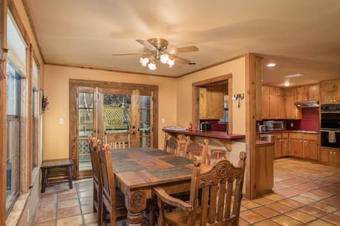 Large dining table with extra seating at the bar.