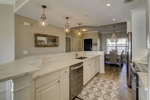View from kitchen toward entry door and dining area