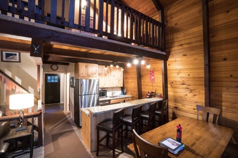Main Level: Dining Room, Kitchen (view to back door, deck access)