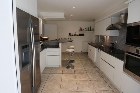 Th kitchen as seen from the indoor dining area 