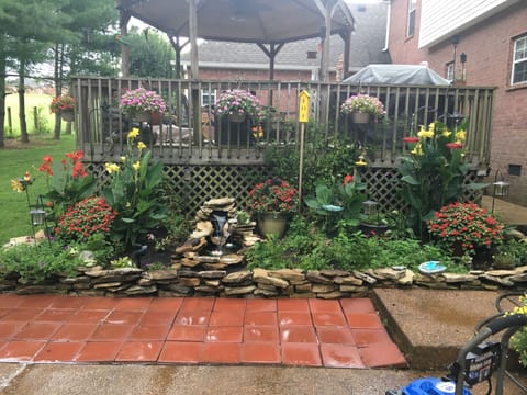 Parking area for 3 cars along the front of the red paver stones