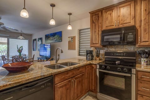 Open concept with full sized appliances including dishwasher.