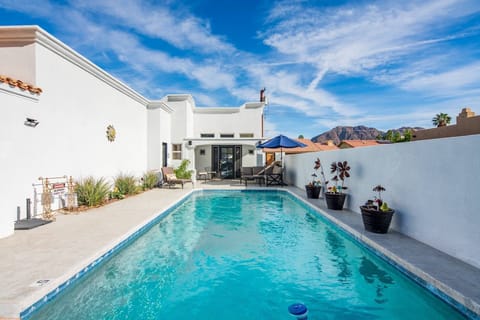 Lovely relaxing pool with seating and umbrella
